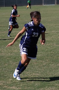 young woman playing soccer