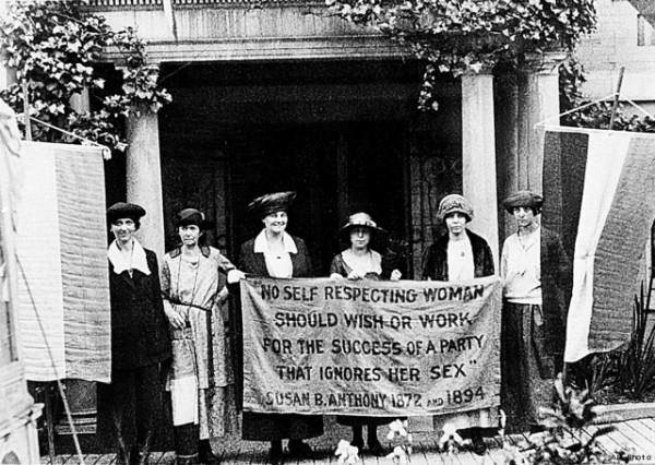 National Woman's Party members standing in front of their headquarters three months ago, with a banner that seems as relevant now as it did during the suffrage struggle: " 'No self respecting woman should wish or work for the success of a party that ignores her sex.' Susan B. Anthony 1872 and 1894."